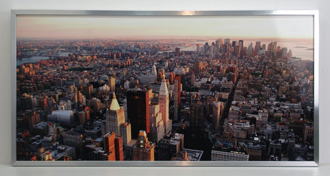 Obraz - Manhattan w promieniach wschodzącego słońca - reprodukcja w ramie STC01 100x50 cm. - Obrazy Reprodukcje Ramy | ergopaul.pl